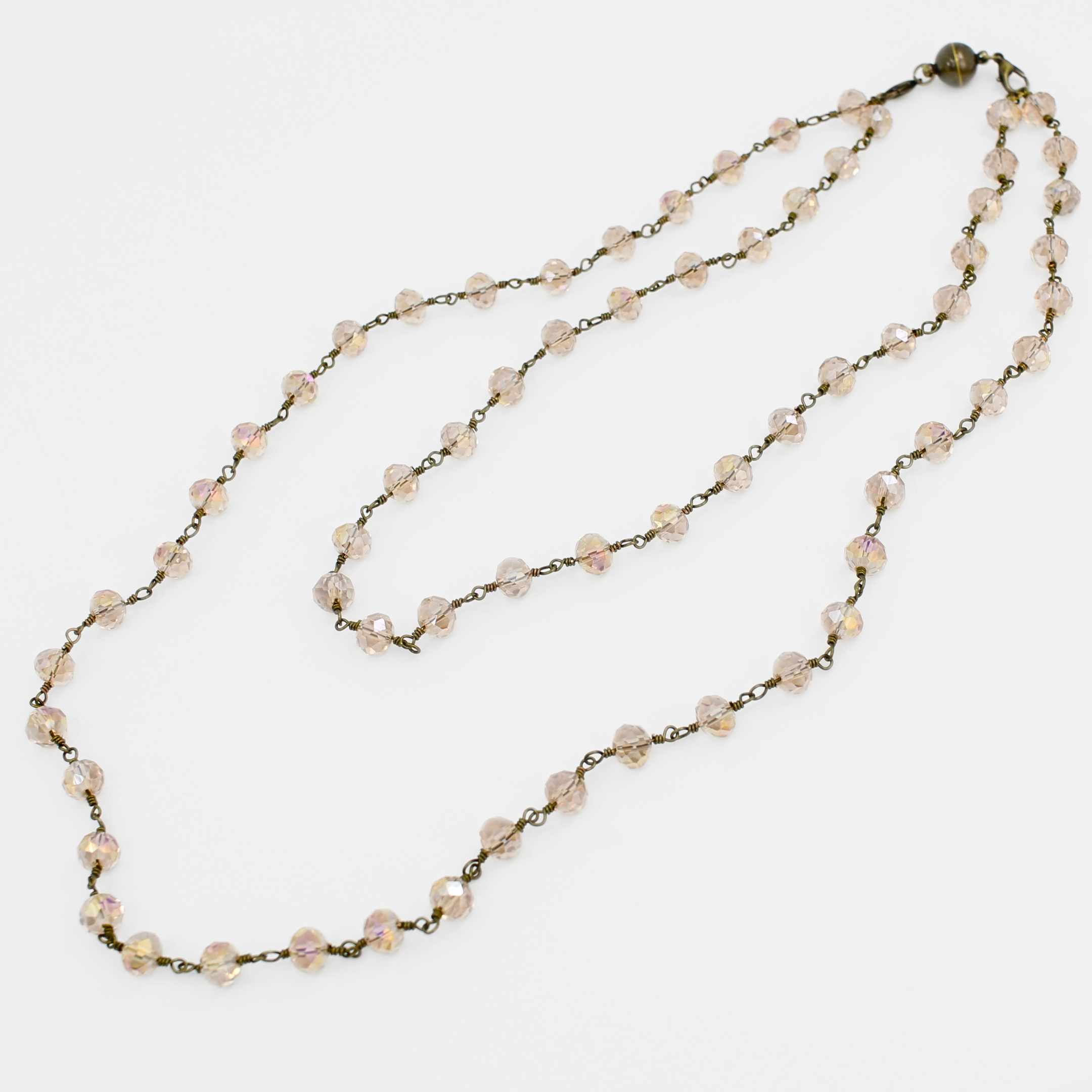 Necklace with pink beads on a white background