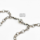Silver chain bracelet with a clasp on a white background