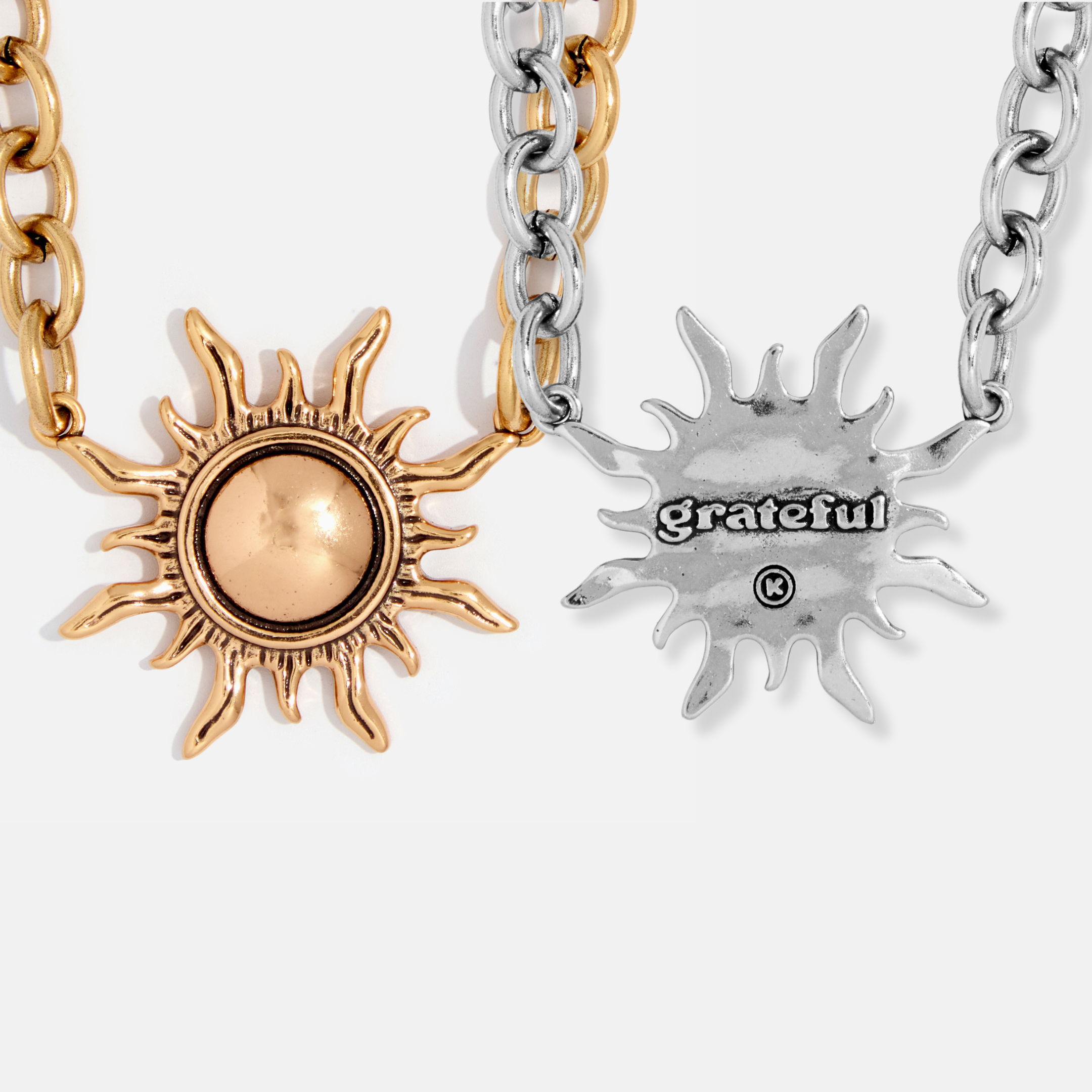 gold choker sun and silver image of message on reverse