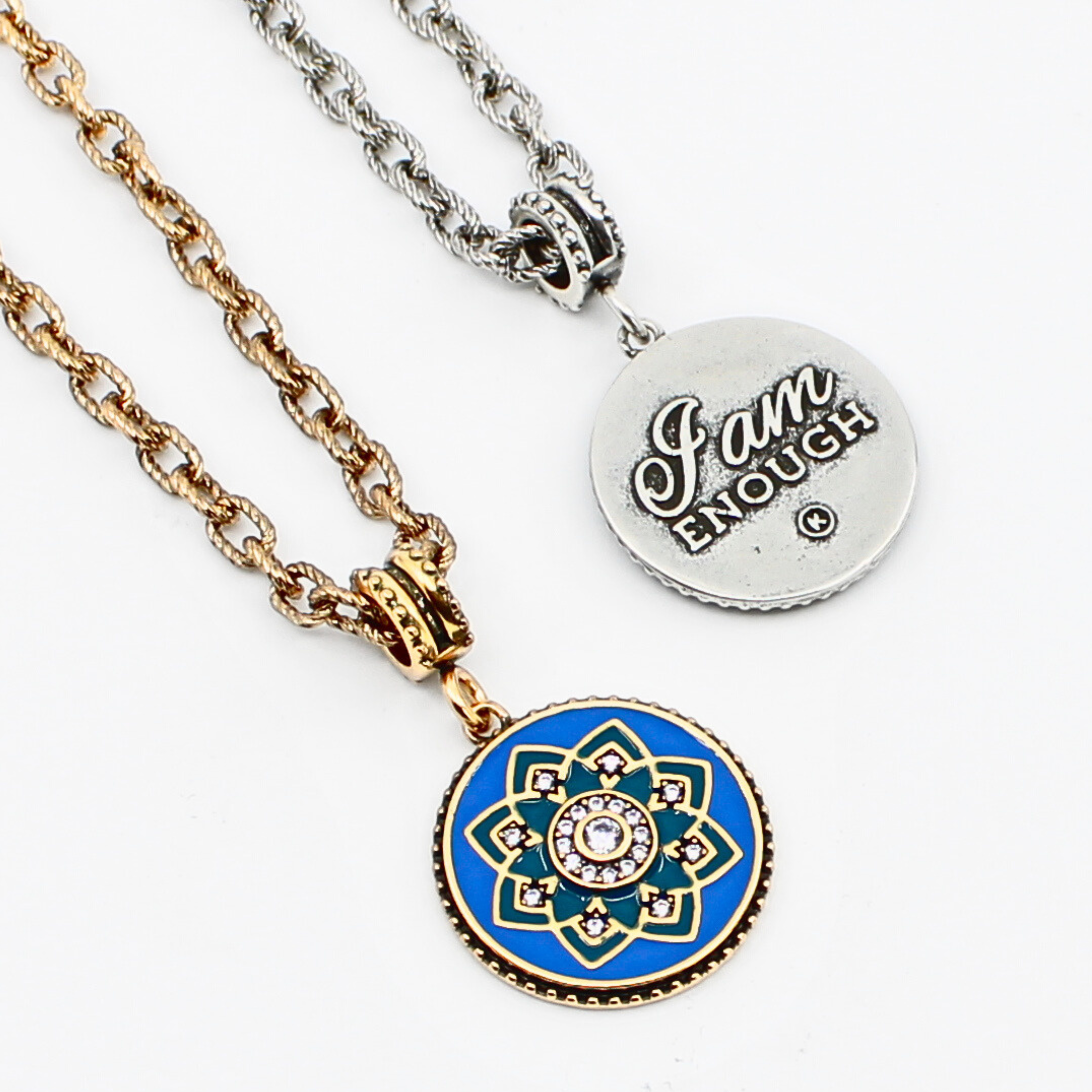 Necklace with blue and gold pendant and silver tag on a white background