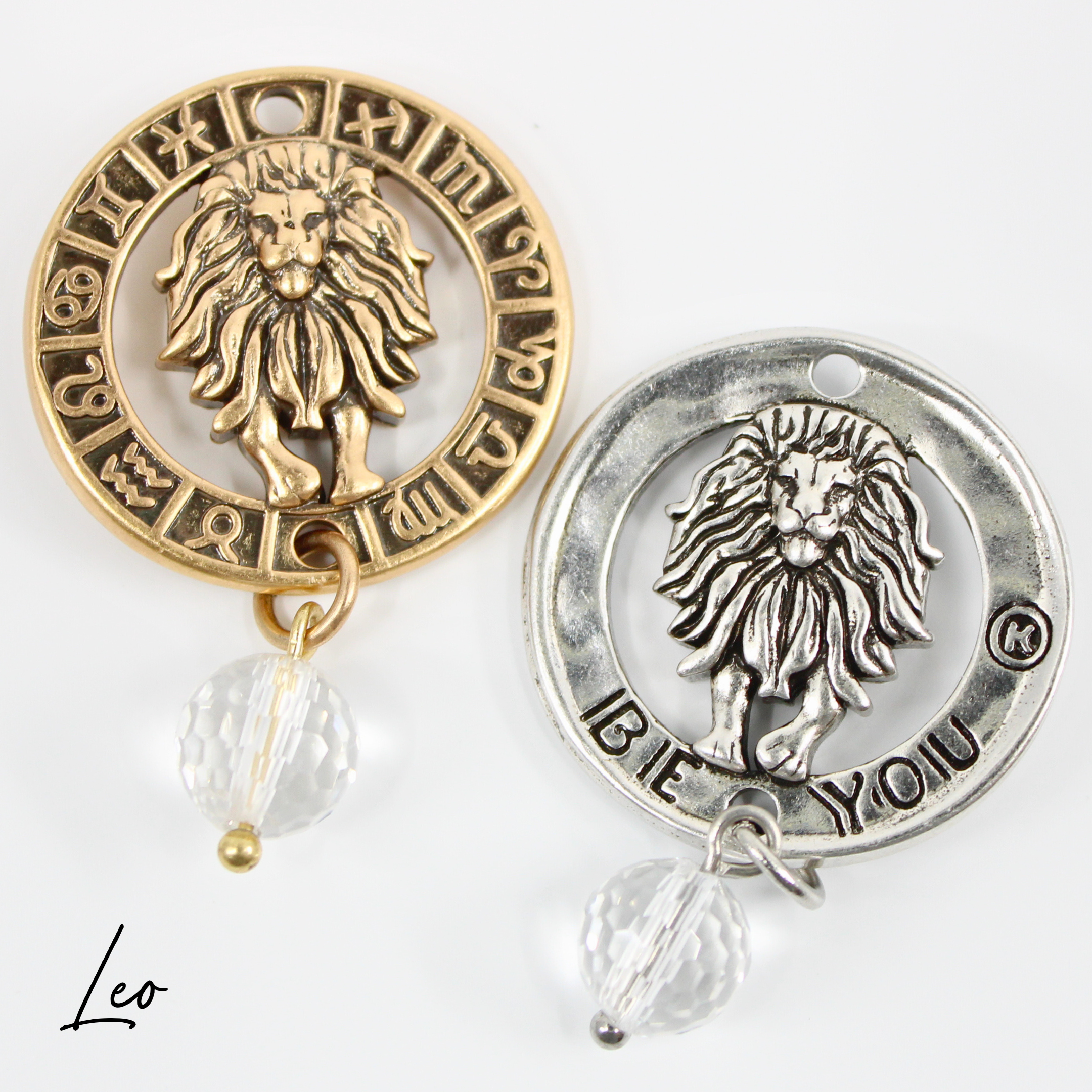 Two necklaces with gold and silver chains, featuring circular pendants with zodiac signs, and faceted crystal quartz accents.