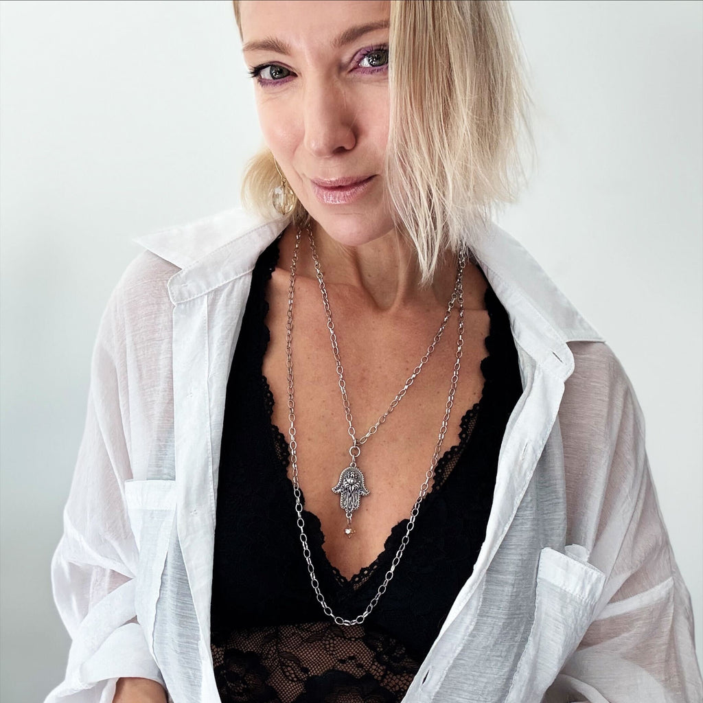 katia wearing the silver original necklace by itself 