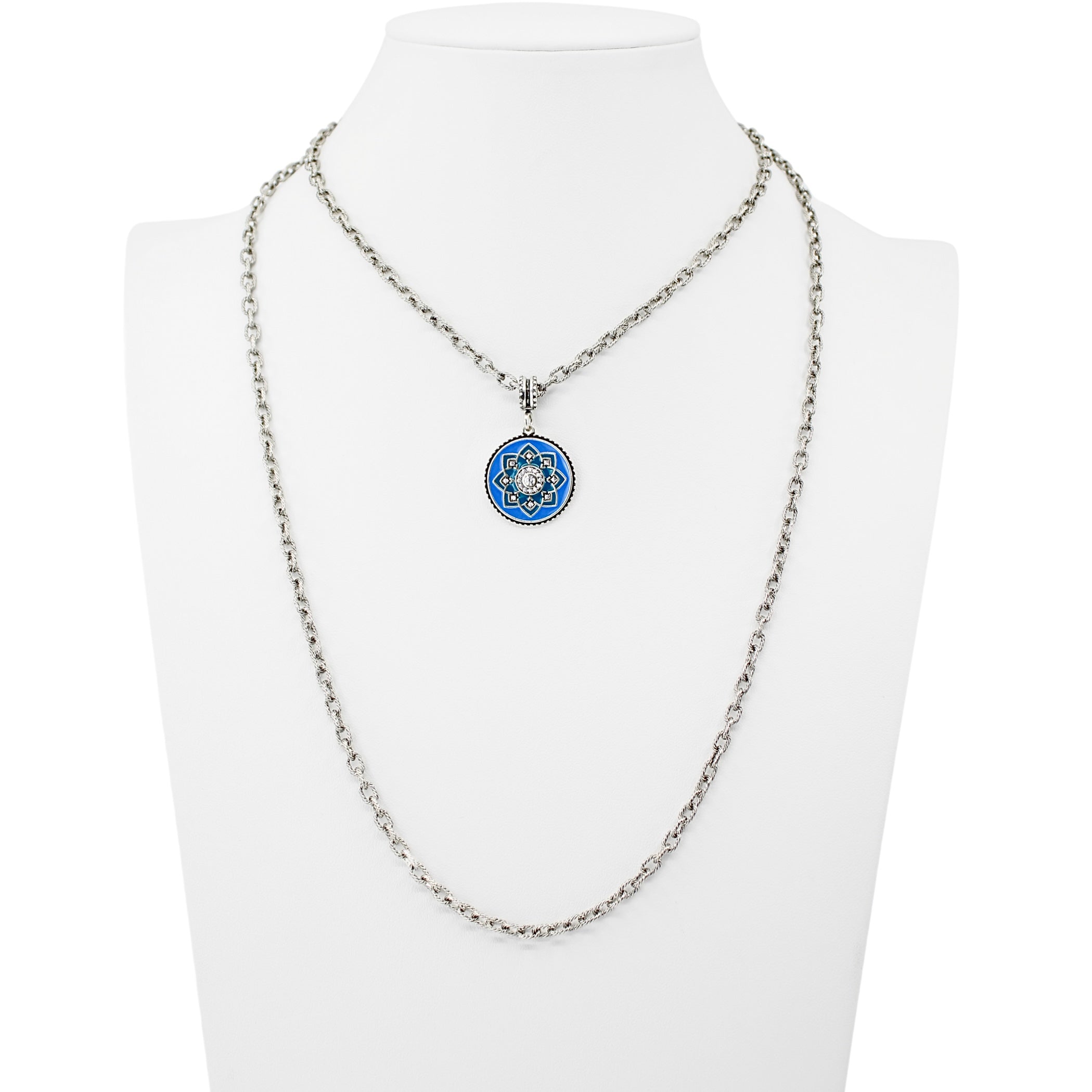 Necklace with a blue and silver pendant on a mannequin bust against a white background