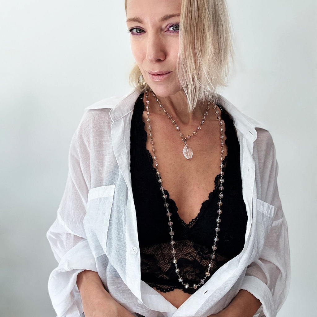 katia modeling silver rosary layering chain 