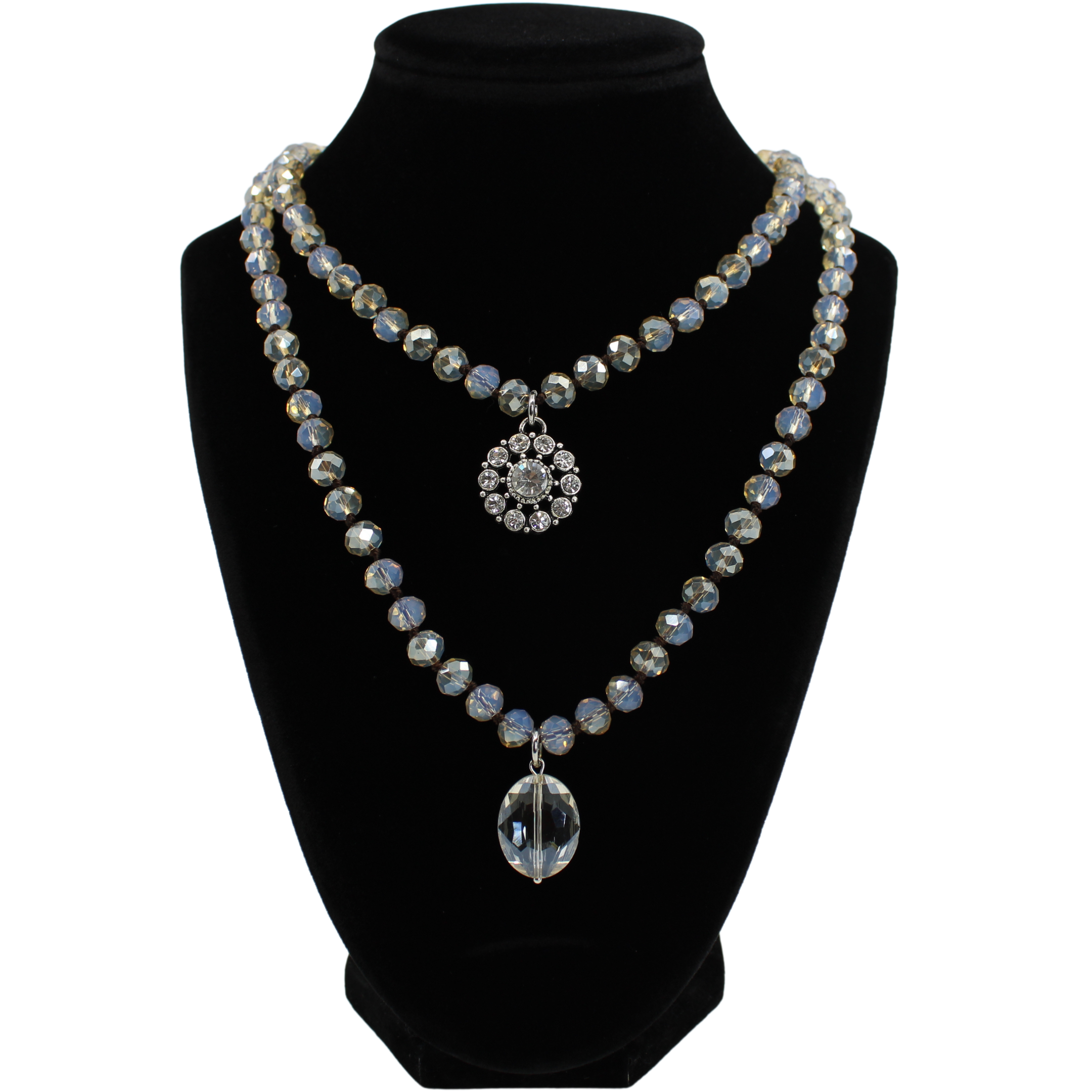 Necklace with crystal pendants on a black mannequin bust