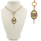 Gold necklace with pendant on a mannequin bust and close-up on a white background