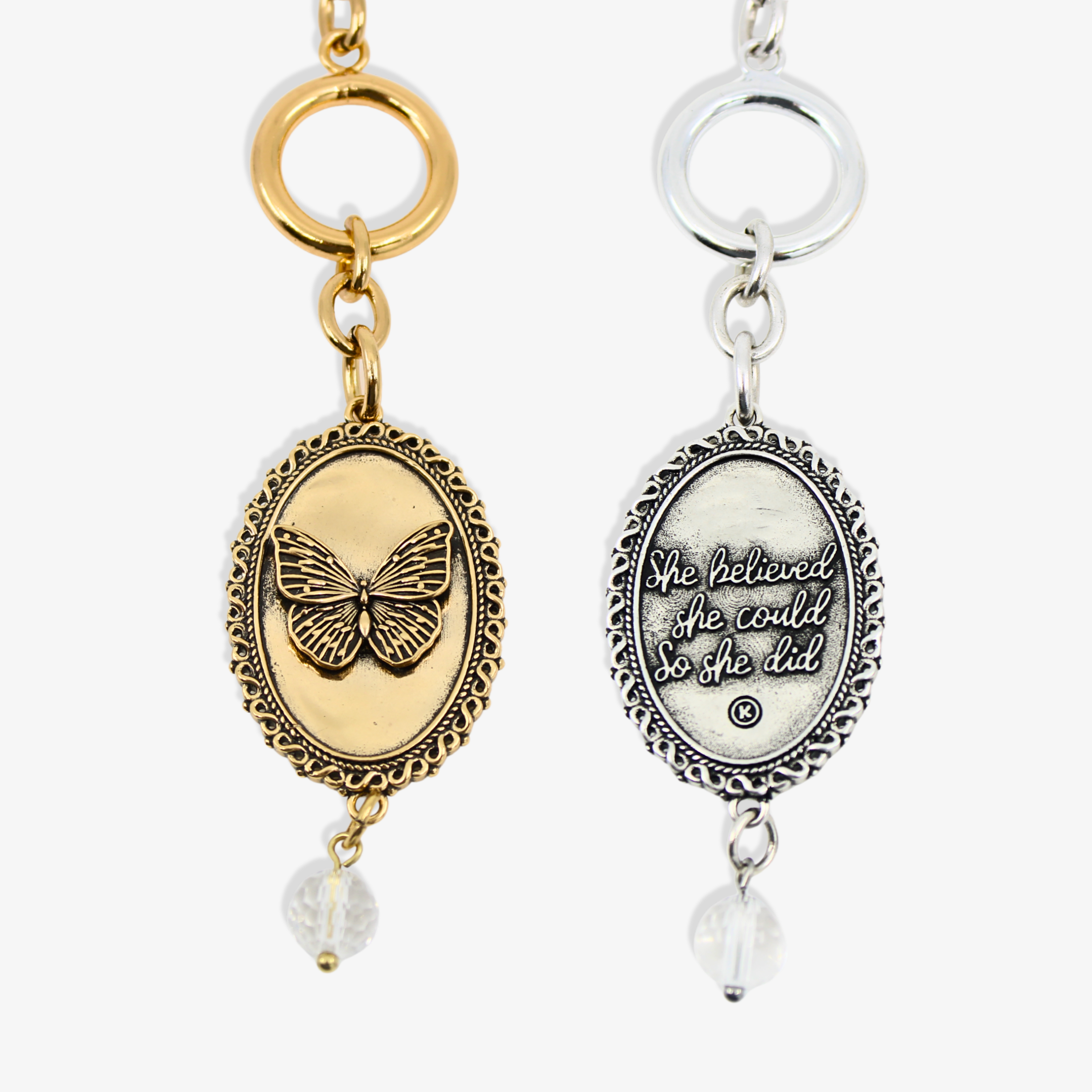 Two keychains, one gold with a butterfly design and the other silver with an inspirational quote, on a white background.