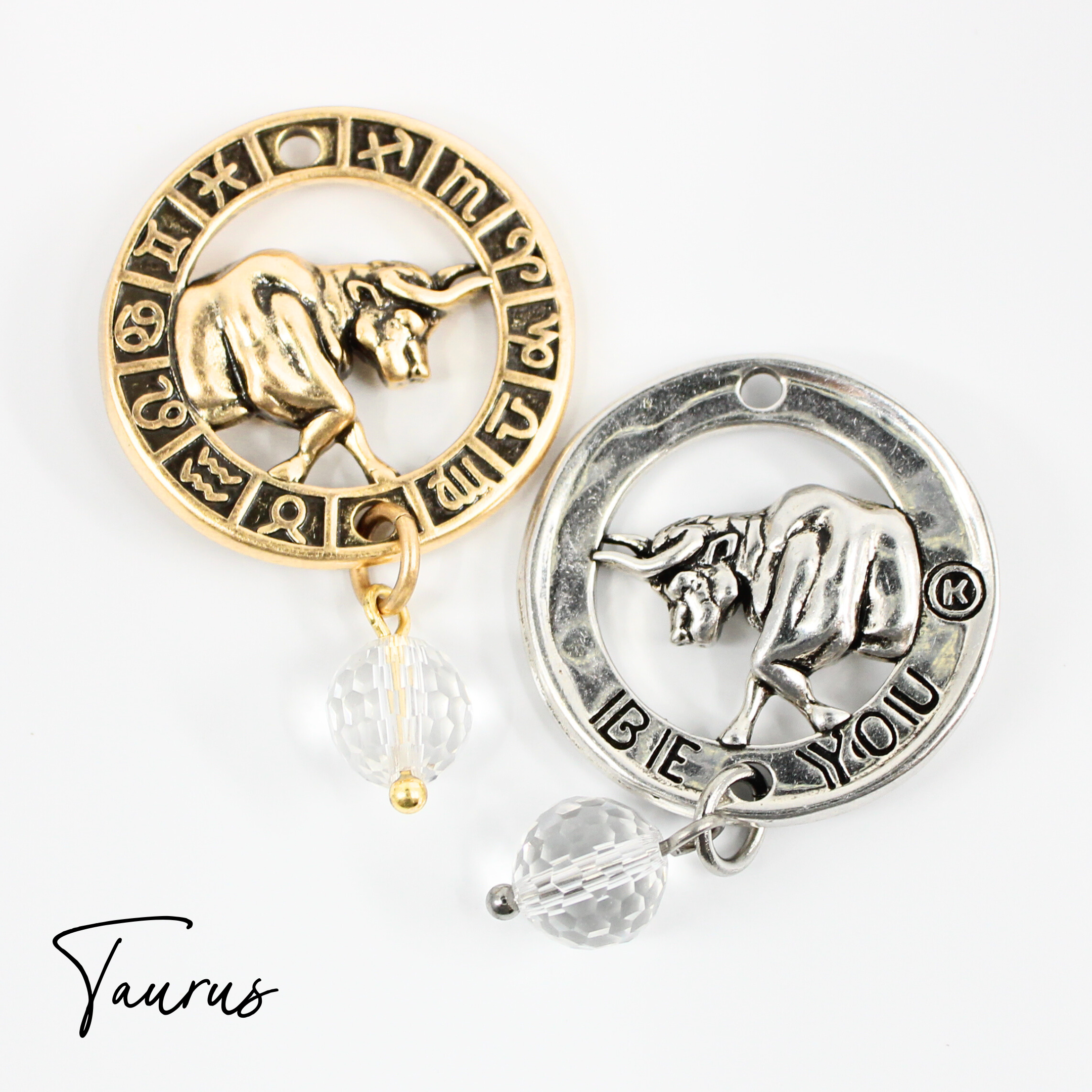 Two necklaces with gold and silver chains, featuring circular pendants with zodiac signs, and faceted crystal quartz accents.